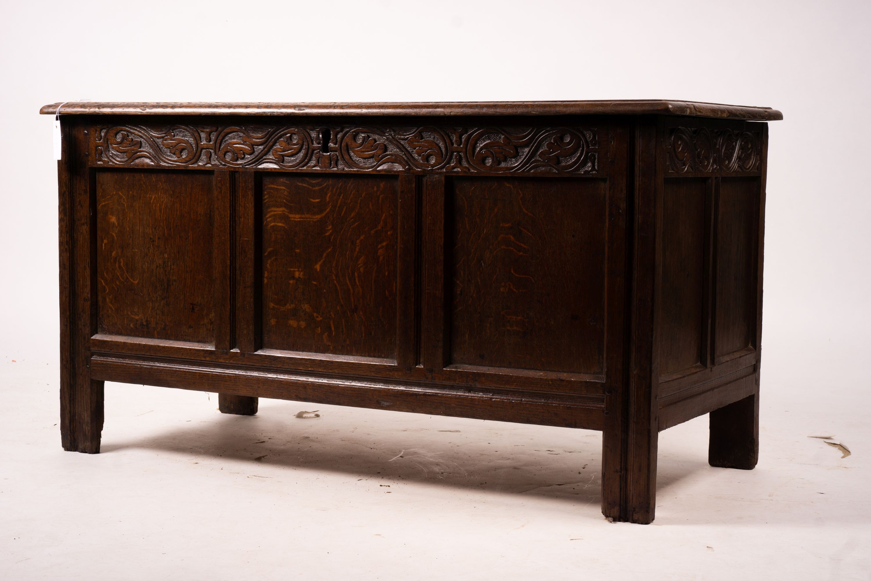 A 17th century panelled oak coffer, W.122cm D.55cm H.65cm